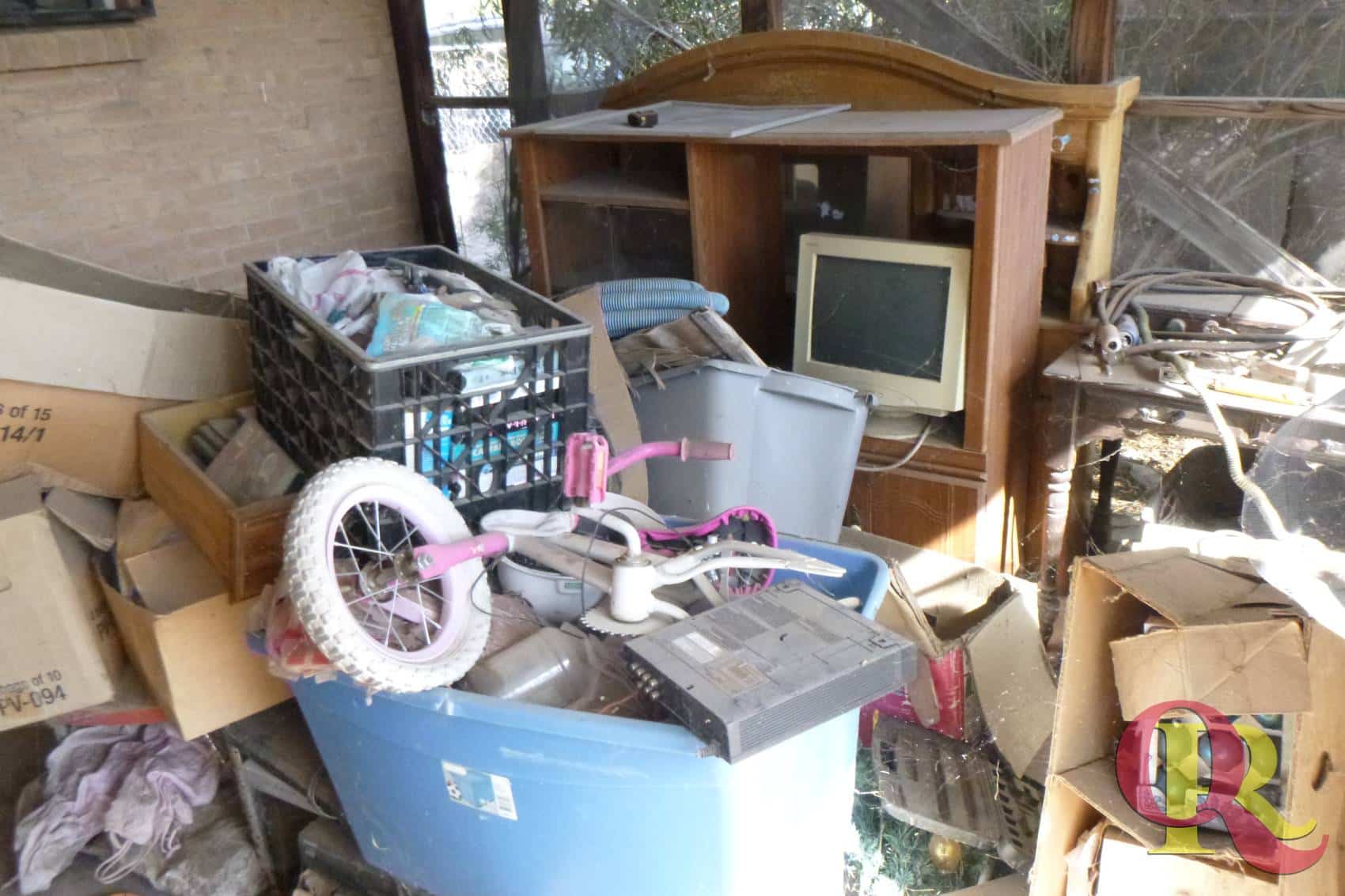 Cluttered garage filled with junk